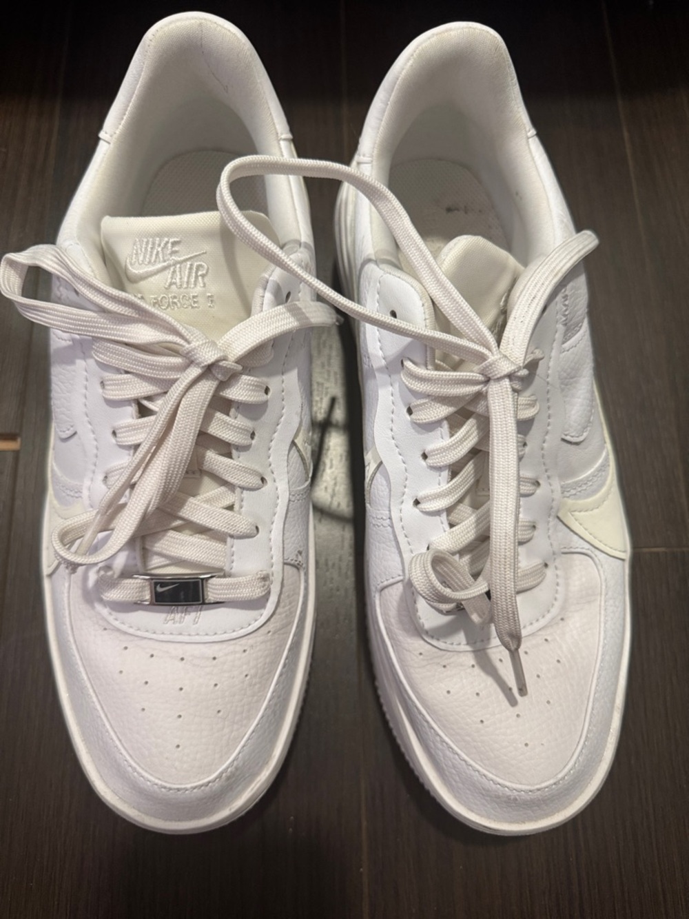 Nike women’s White Low-Top Leather Air Force 1 Sneakers
